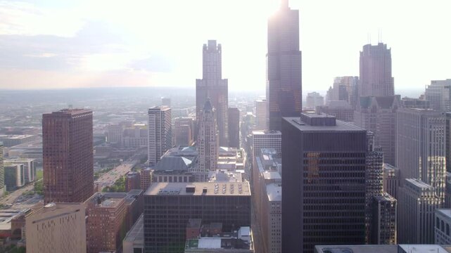 Experience the dynamic atmosphere of Chicago's crowded streets and skyline through captivating drone visuals.