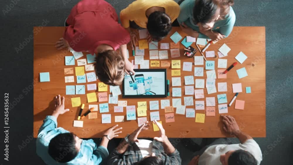 Poster aerial view of developer team discussing and showing digital program and writing by using ux ui desi