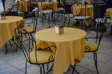 Yellow metal table in a restaurant in Syracuse