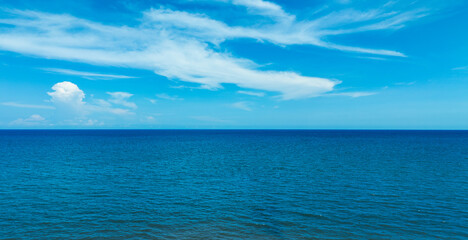 Nature of the beach and sea Summer with sunshine, sandy beaches, clear blue waters sparkling against the blue sky. On an island with good ecology and environment Background for summer vacation