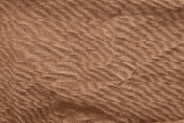 Texture of beige corduroy pants close up