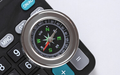 Notepad with compass on white background. Business concept