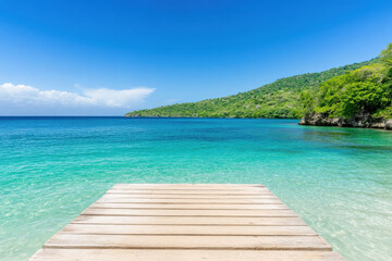 Fototapeta premium A wooden pier is in front of a beautiful blue ocean