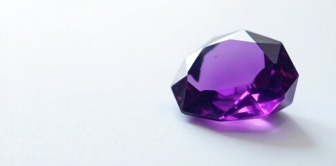 Deep purple gemstone isolated on white surface, decorative element, amethyst