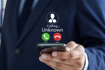 Human use smartphone with incoming call from unknown number, spam, prank caller, hoax person, fake identity, scammer, scam with mobile phone, hacker, call center, crime, call, fraud or phishing