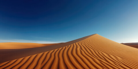 Naklejka premium Majestic Sand Dunes Under Clear Blue Sky Capturing Tranquility and Natural Beauty