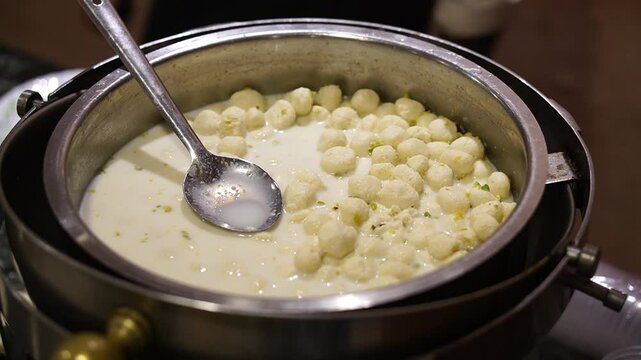Milky ras malai looking delicious to be served in wedding.