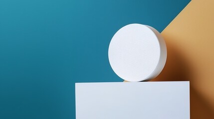 Fototapeta premium White Textured Cylinder On Platform Against Teal And Tan Background