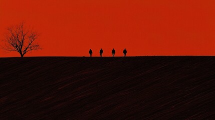 Obraz premium Silhouetted figures walking across a plowed field at sunset