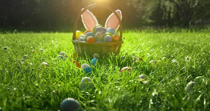 Colorful decorated easter eggs in wicker basket.