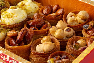 Traditional Middle Eastern dessert assortment displayed in an elegant box at a festive gathering