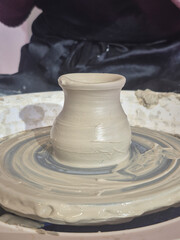 ceramic artist woman makes coffee cup