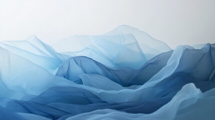 Obraz premium Delicate layers of translucent blue fabric undulate like gentle hills, evoking a tranquil natural landscape. The soft tones blend harmoniously, creating a calm ambiance