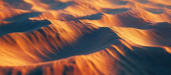 Close up of intricate sand dune textures in warm golden hues, with rippled patterns creating unique...