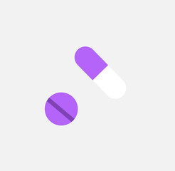 capsule and tablet on a light grey background,