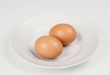 Two eggs in a small dish on a white background