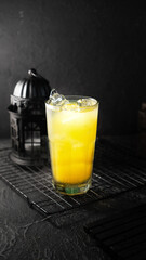 orenge juice Ice in dark background