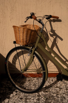 Vintage Bicycle with Basket Against a Warm Italian Wall