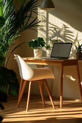 Fototapeta premium Sunlit Home Office Workspace With Plants and Laptop