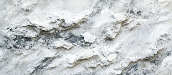 Fototapeta premium Textured white and grey marble surface with subtle veining, featuring layered formations and natural patterns, ideal for backgrounds and designs.