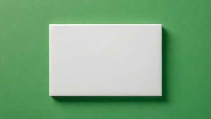 Fototapeta premium Clean white canvas on a vibrant green background, showcasing modern simplicity and elegance