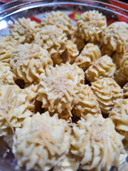 A bowl of sagu keju, cheese butter cookies