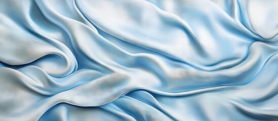 Obraz premium Elegant light blue silk and satin textures showcase smooth, flowing fabric with soft drapes and a luxurious sheen against a subtle background.