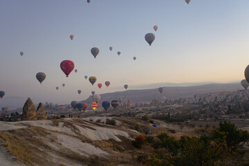 Beautiful view of hot air balloon flying over rock landscape at Cappadocia Turkey
