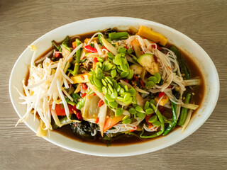 Papaya salad with fermented fish, spicy food asian thailand, fusion cuisine som tum traditional  herb cook.