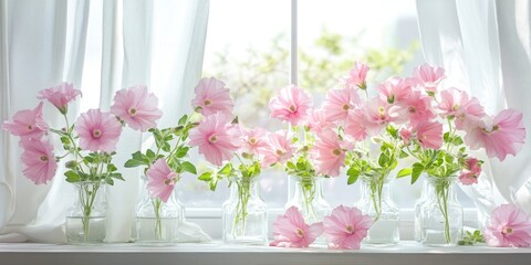 Delicate pink flowers in various glass vases against a bright window with white curtains creating a serene floral arrangement in soft lighting.