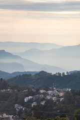Wisps of mist envelop the rolling hills of Kodaikanal as dawn breaks, revealing the serene beauty of this popular hill station in India