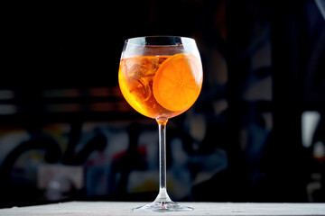 A classic Aperol Spritz made with Aperol, prosecco, and soda water, garnished with an orange slice