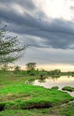 Cloudy sky with a lake in the background