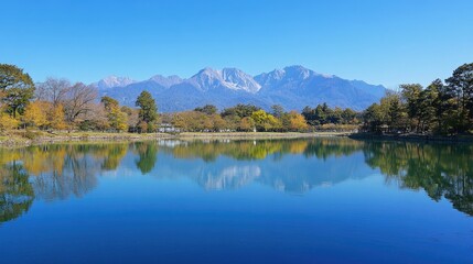 Panoramic view of a serene alpine landscape featuring a majestic mountain with a snow-capped peak,