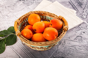 Raw ripe sweet apricots heap