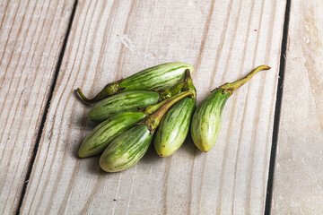 Small organic young green eggplant