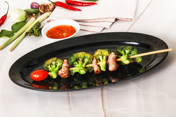 Thai Street foof satay with bacon and broccoli