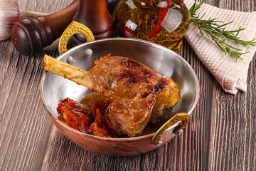 Baked lamb shank with vegetables
