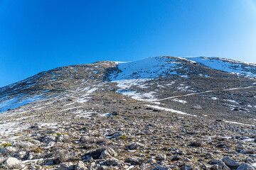The scenic views of Tahtalı Dağı, Mount Olympos (2365 m.) with snow and flying clouds in...