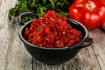 Diced ripe tomato with sauce