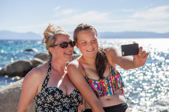 Mom and Daughter take a Selfie at the lake