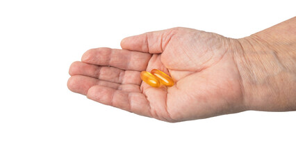 Senior female hand holding yellow omega-3 capsules in a palm, fatty acids, fish oil supplements, isolated on a transparent background