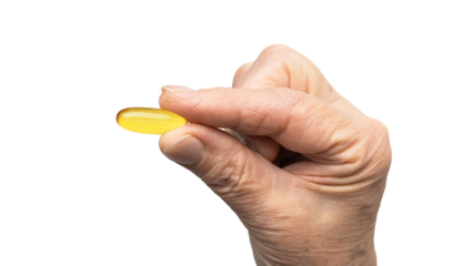Senior female hand holding one yellow omega-3 capsule, fatty acids, fish oil supplements, isolated on a transparent background