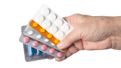 Senior female hand holding various blister packs of prescription medication, antibiotic pills,...