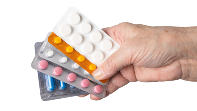 Senior female hand holding various blister packs of prescription medication, antibiotic pills, painkiller capsules, isolated on a transparent background. Healthcare, elderly care, medical treatment 