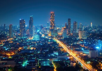 Fototapeta premium Stunning Urban Nightscape of a Vibrant City Skyline with Glowing Lights, Tall Buildings, and Flowing Traffic Captured from a High Angle Viewpoint