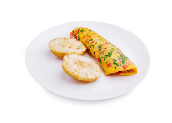 Delicious omelette with herbs served alongside two seasoned potatoes on a white plate