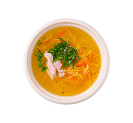 Warm bowl of delicious chicken noodle soup garnished with fresh herbs and colorful vegetables served in a white bowl