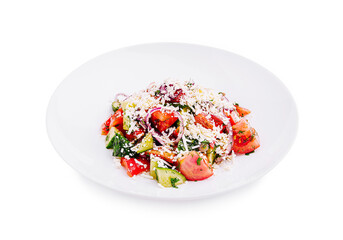 Fresh vegetable salad with herbs and cheese served on a white plate