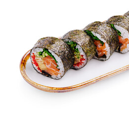 Fresh sushi rolls arranged on a decorative plate with vibrant colors and textures from various ingredients